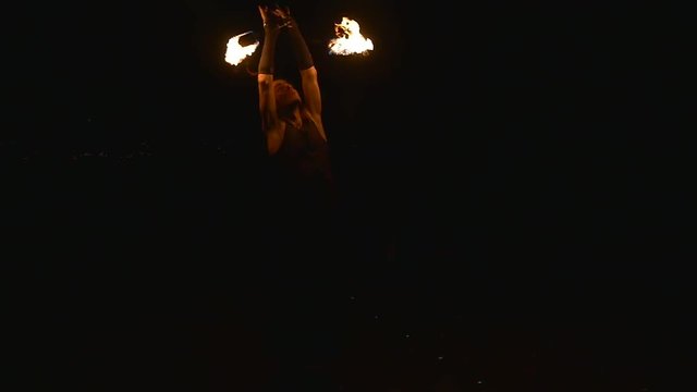 Street fire dancer at night