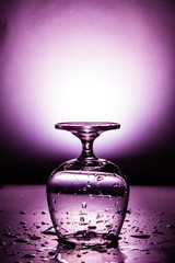 Obraz na płótnie Canvas Wet wine glass with water drop