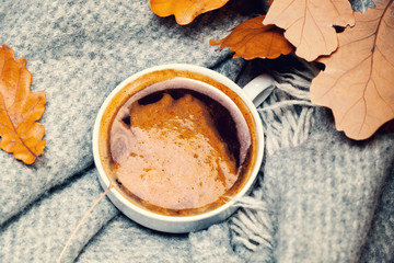 ..Red and Orange Autumn Leaves Background with coffee cup.  Yell