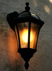 Retro street wall lamp with yellow orange light
