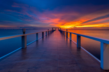 Fototapeta na wymiar Summer, Travel, Vacation and Holiday concept - Wooden pier between sunset in Phuket, Thailand