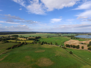 Fototapeta na wymiar aerial view of agricultural fields and lakes in germany