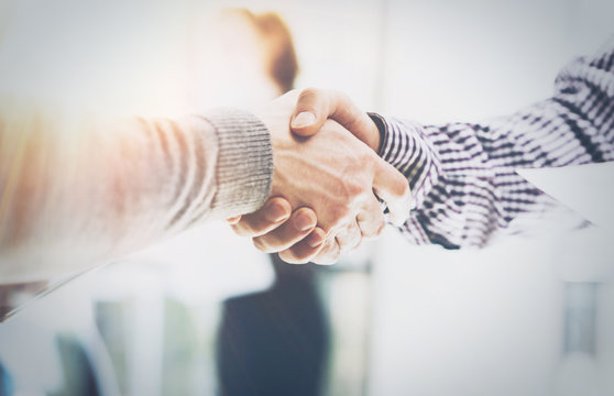 Business Partnership Meeting.Photo Two Businessmans Hands Handshake Process.Successful Businessmen Handshaking After Excellent Corporate Deal.Horizontal, Blurred Background.