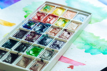 Set of watercolor paints and paintbrushes for painting