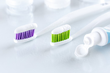 two toothbrushes on white background