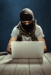 Terrorist working on his computer