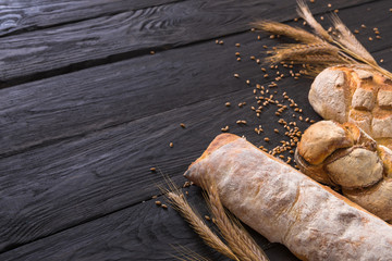 Bread bakery background. Brown and white wheat grain loaves composition
