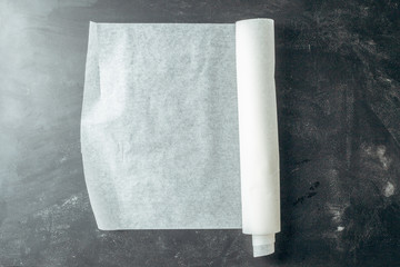 Baking paper on wooden kitchen table