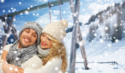 happy family couple in winter clothes hugging