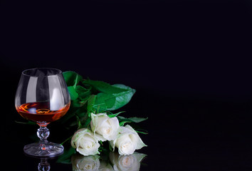Glass and rose. Alcohol and flower.