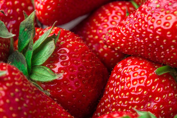 Fresh strawberry background. Ripe  in close-up.