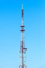 Telecommunication tower over blue sky