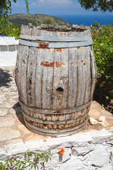 Old wooden barrel in summer garden