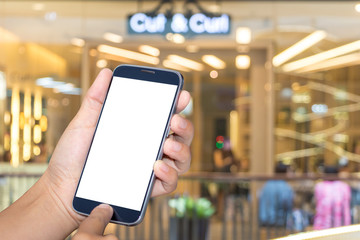 Asian women hand holding mobile phone screen blank background blur bokeh at a coffee shop in the department stores.
