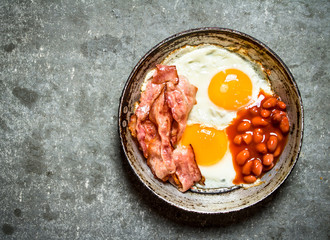 fresh Breakfast. Fried bacon with eggs and red beans.