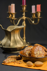 Typical Dutch filled spicy  cookies with almonds on autumn colors with brass table equipment