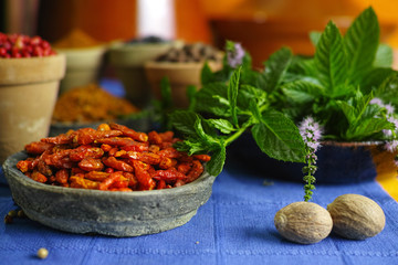 Old clay bowls with red hot chili peppers and  different spices
