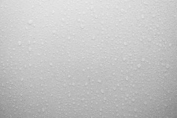 Water drops on frosted glass texture as background
