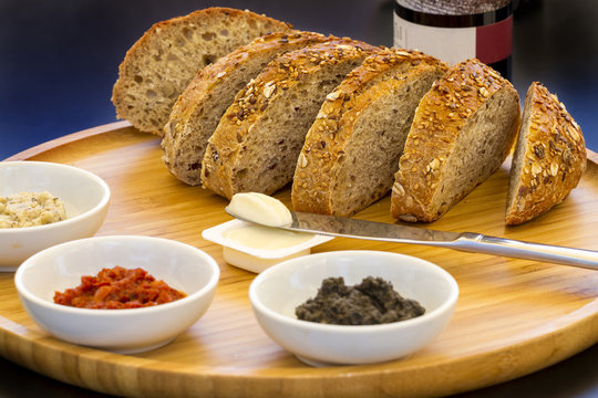 Fresh sliced country style whole grain bread with a mix of sprea