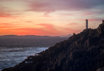 faro al atardecer, puesta de sol
