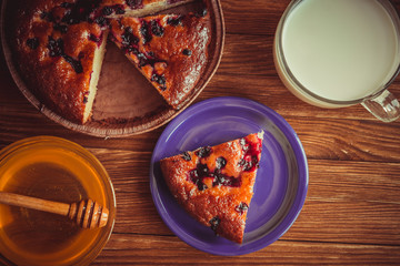 Fruit cake, honey and milk.