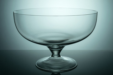 Glass vase to fruit on gradient background