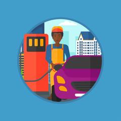 Worker filling up fuel into car.