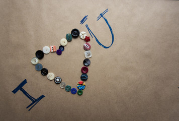 an inscription on a brown background of the buttons and pen