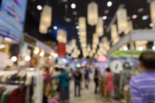 people shopping in exhibition trade fair - blur