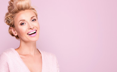 Beauty portrait of smiling blonde woman.