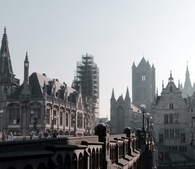 Cityscape of Ghent  - old European Belgian city -misty morning in autumn. Toned image,  high angle.