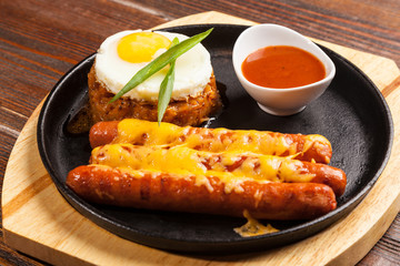 sausages in a pan with cheese
