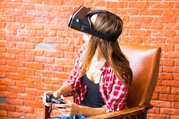 Obraz na płótnie Canvas Woman play video game with joystick and VR device