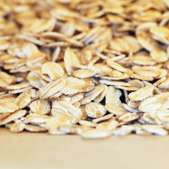 Pile of oat flakes in paper bag