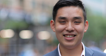 Young Asian man in city portrait face