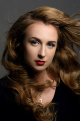 Fototapeta premium beautiful young brunette woman with flying hair