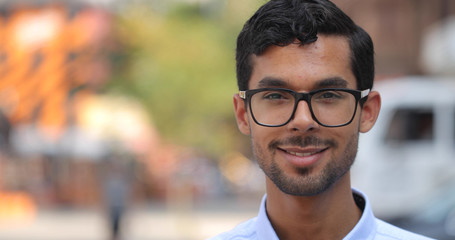 Young man in city face portrait smile happy