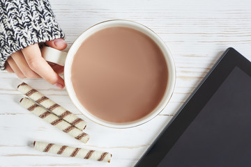 Cocoa cup and woman hand