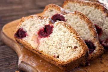 Sponge cake sliced on cutting board. Selective focus.
