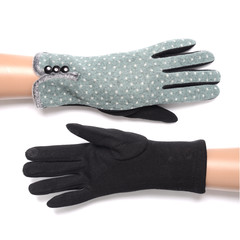 women's gloves with polka dots isolated on white