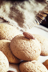 Homemade almond cookies, vintage wooden background, toned image,