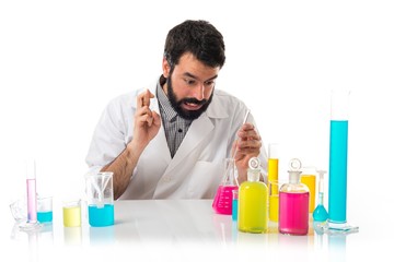 Scientist man with his fingers crossing
