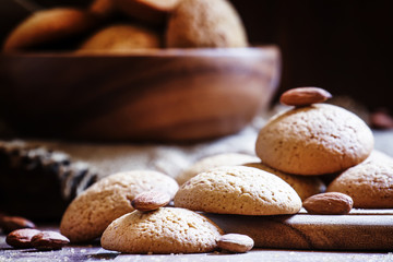 Homemade almond cookies, vintage wooden background, toned image,