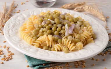 fusilli pasta with onion and peas