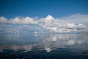 Reflections of clouds on a windless day in northern germany