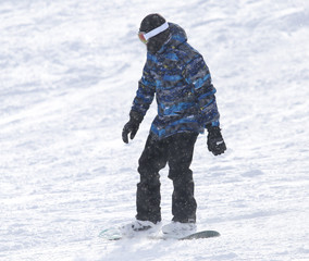Fototapeta na wymiar people snowboarding on the snow in the winter