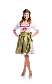 Beautiful woman in traditional bavarian dress, studio shot