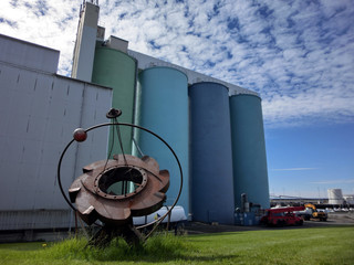 Rusty old metal gear sprocket colorful grain silo