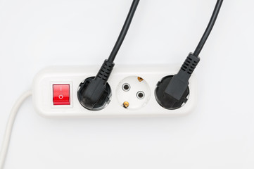 Power outlet and power cables on white background