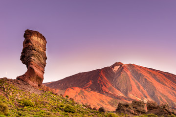 Roques de Garcia stone and Teide mountain volcano at the sunny morning in the Teide National Park,...